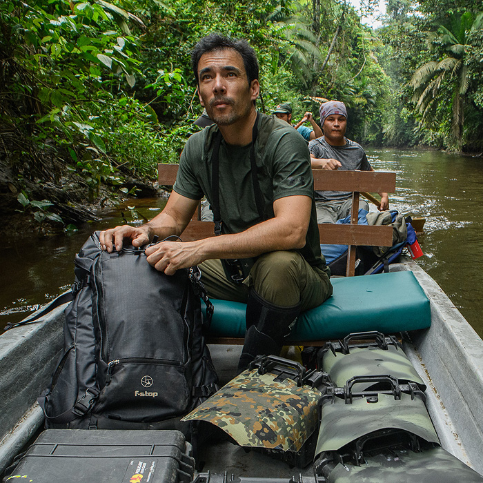 Image showing photographer Chien Lee on a dugout canoe